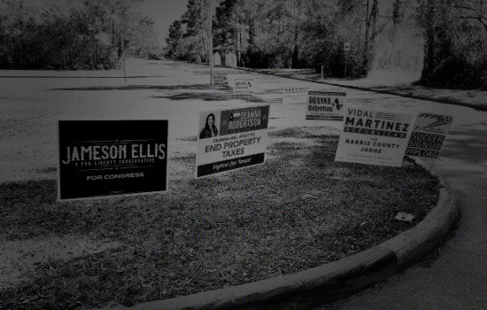 Campaign signs at polling location for voter confidence